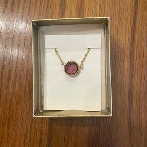 Gold chain necklace with purple stone